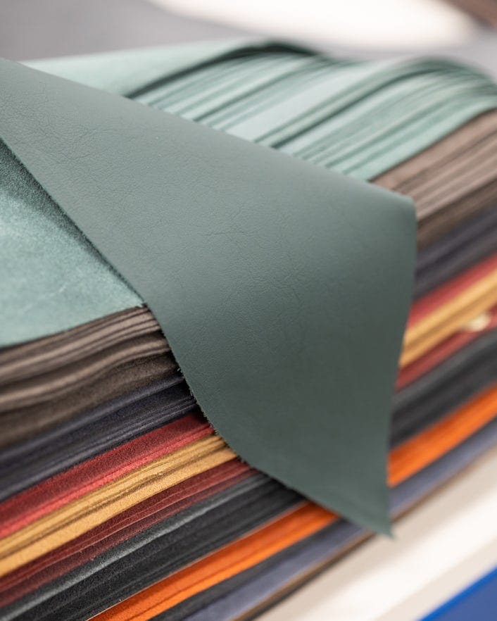 Stack of leather in different colours.