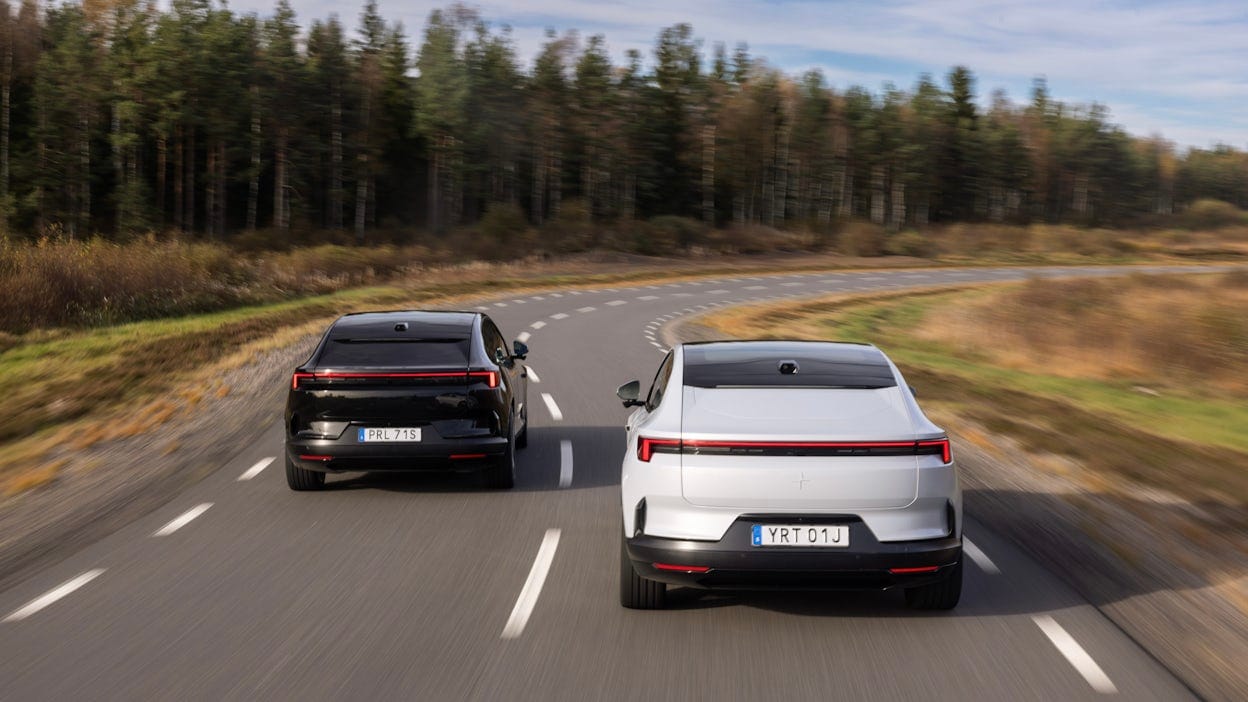 Two polestar 4s drive down winding country road