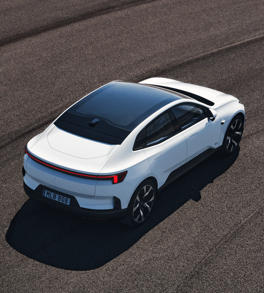 Polestar 4 driving on race track in desert landscape