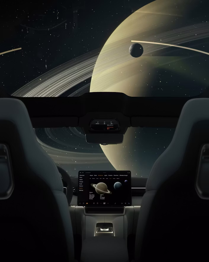 Interior of Polestar car with Saturn and its rings visible through the windshield, central screen displaying planetary data.