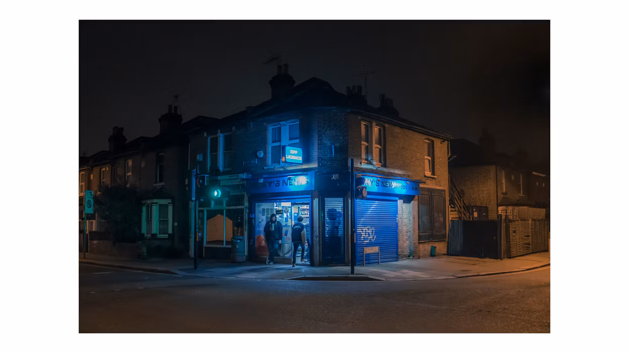 Outside a convenient store at night.