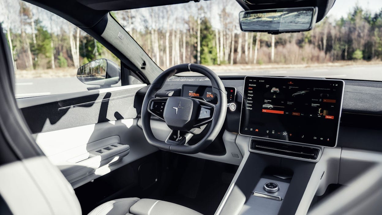 Inside a Polestar 4, showing the steering wheel and display