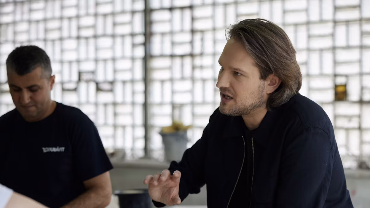 Sebastian Herkner talking at his design studio