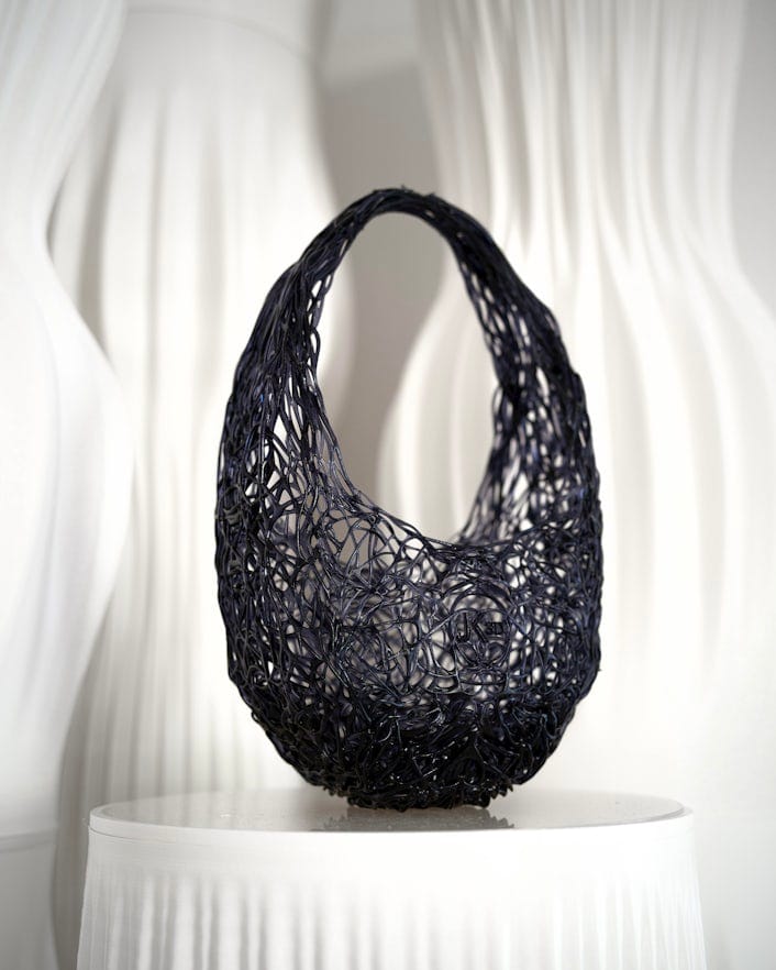 a black 3D printed handbag