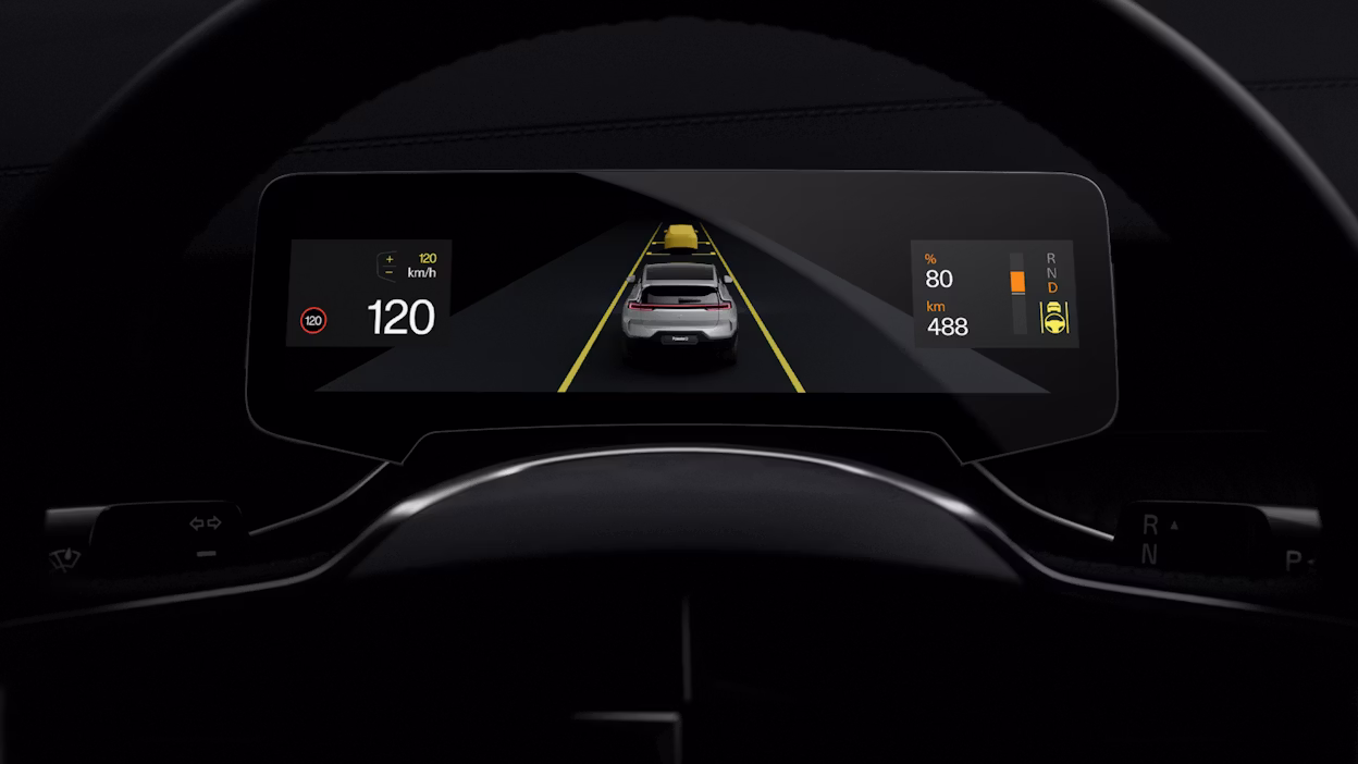 Dashboard display showing Polestar car on road with speed, battery percentage, and range information.