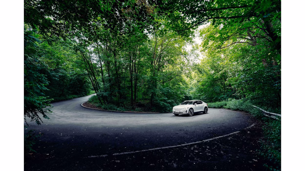 Polestar 2 driving up the forest in berlin