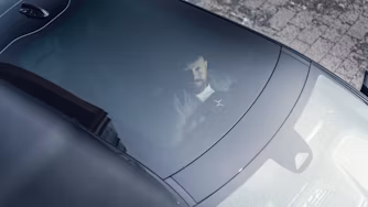 Polestar car windshield with interior view and exterior reflection.