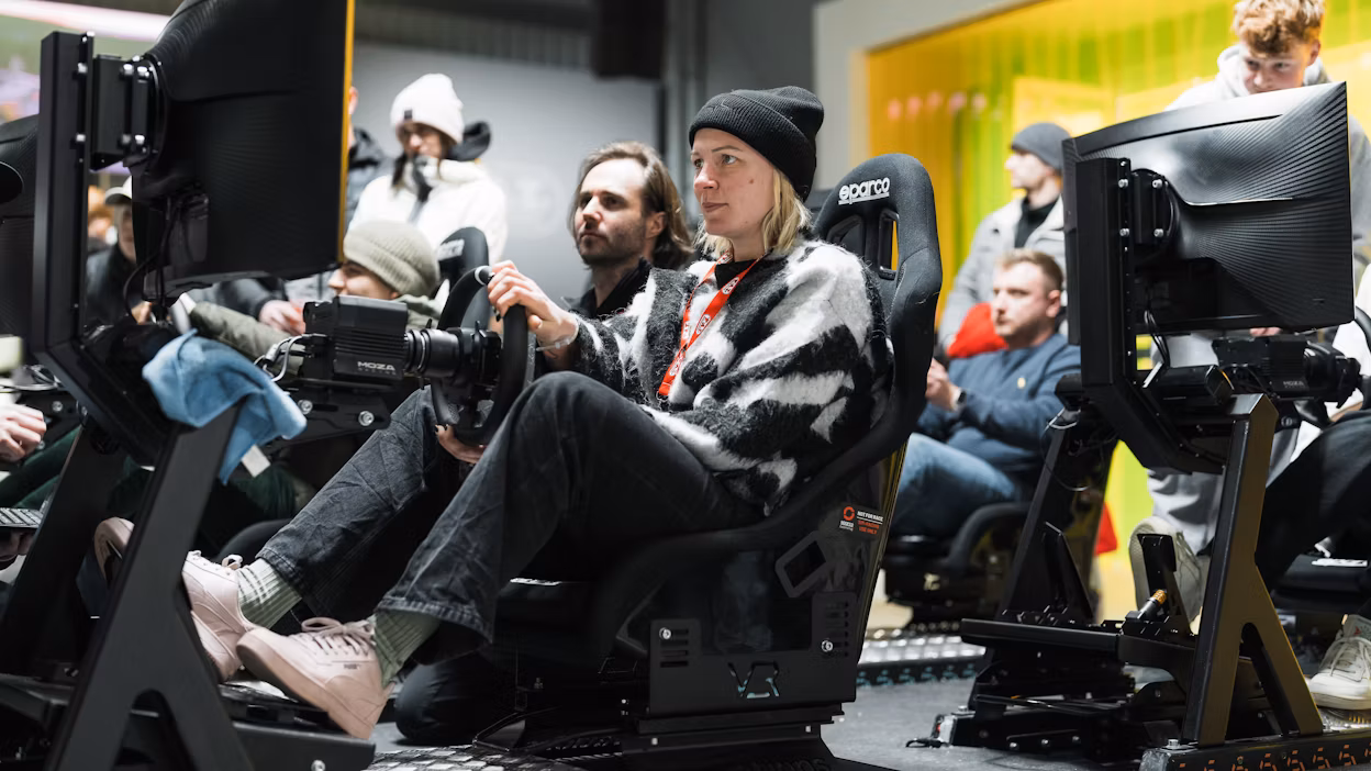 Attendees playing racing simulator