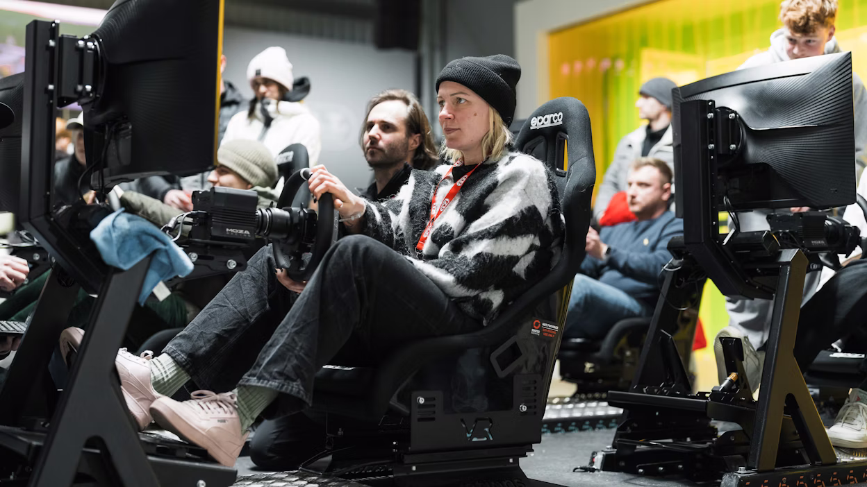 Attendees playing racing simulator