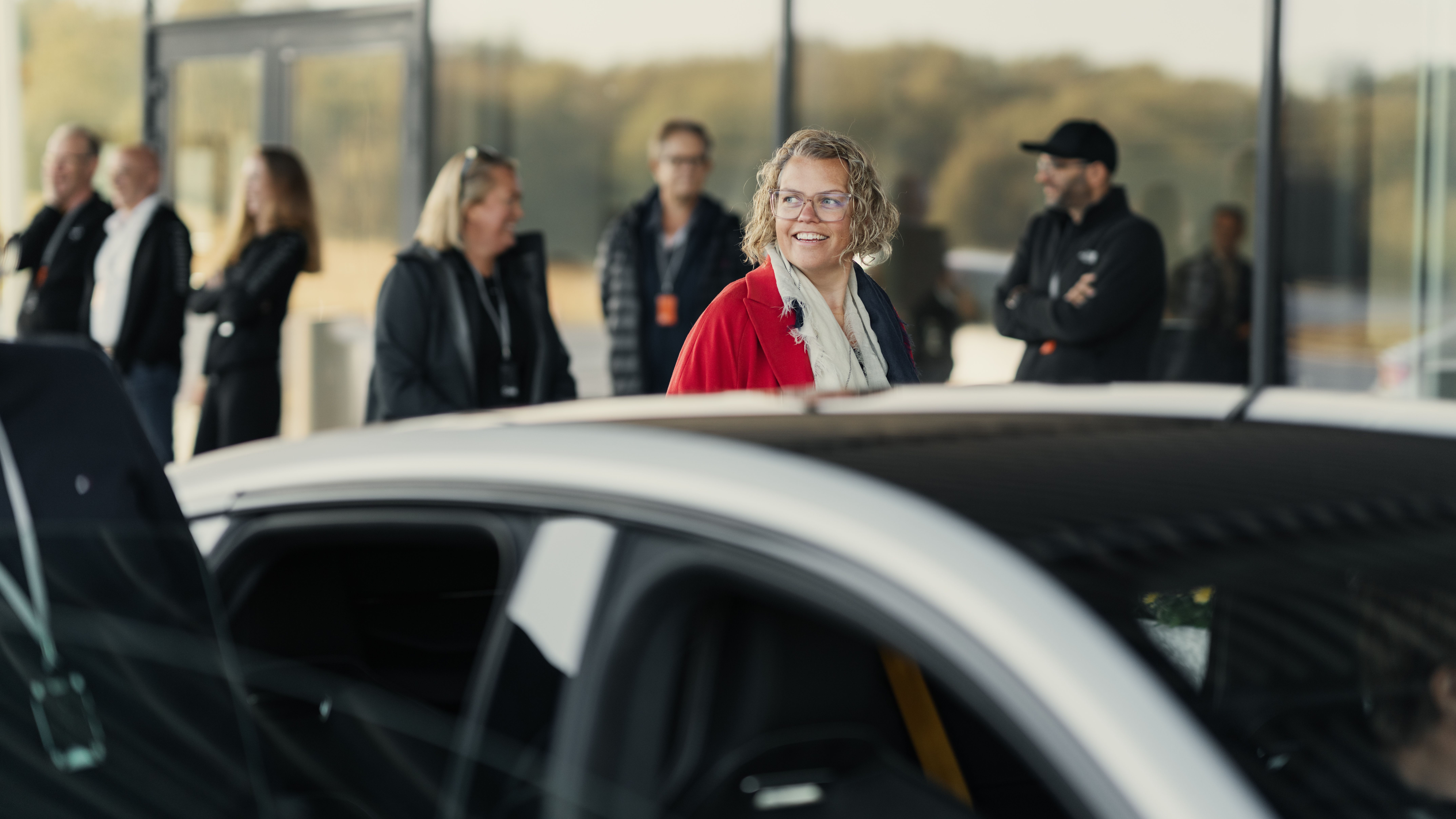 Happy Polestar ownes wit a car in the foreground