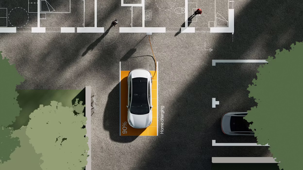 Polestar 4 parked in a designated charging spot with 90% charge, connected to a charging cable, surrounded by trees and shadows.