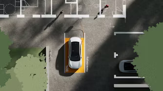 Polestar 4 parked in a designated charging spot with 90% charge, connected to a charging cable, surrounded by trees and shadows.