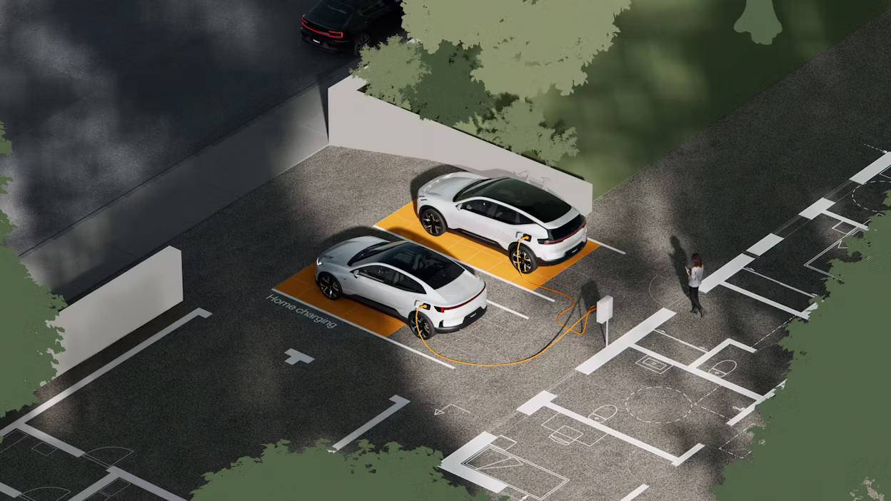 Polestar 3 and Polestar 4 parked on parking spots with green trees around