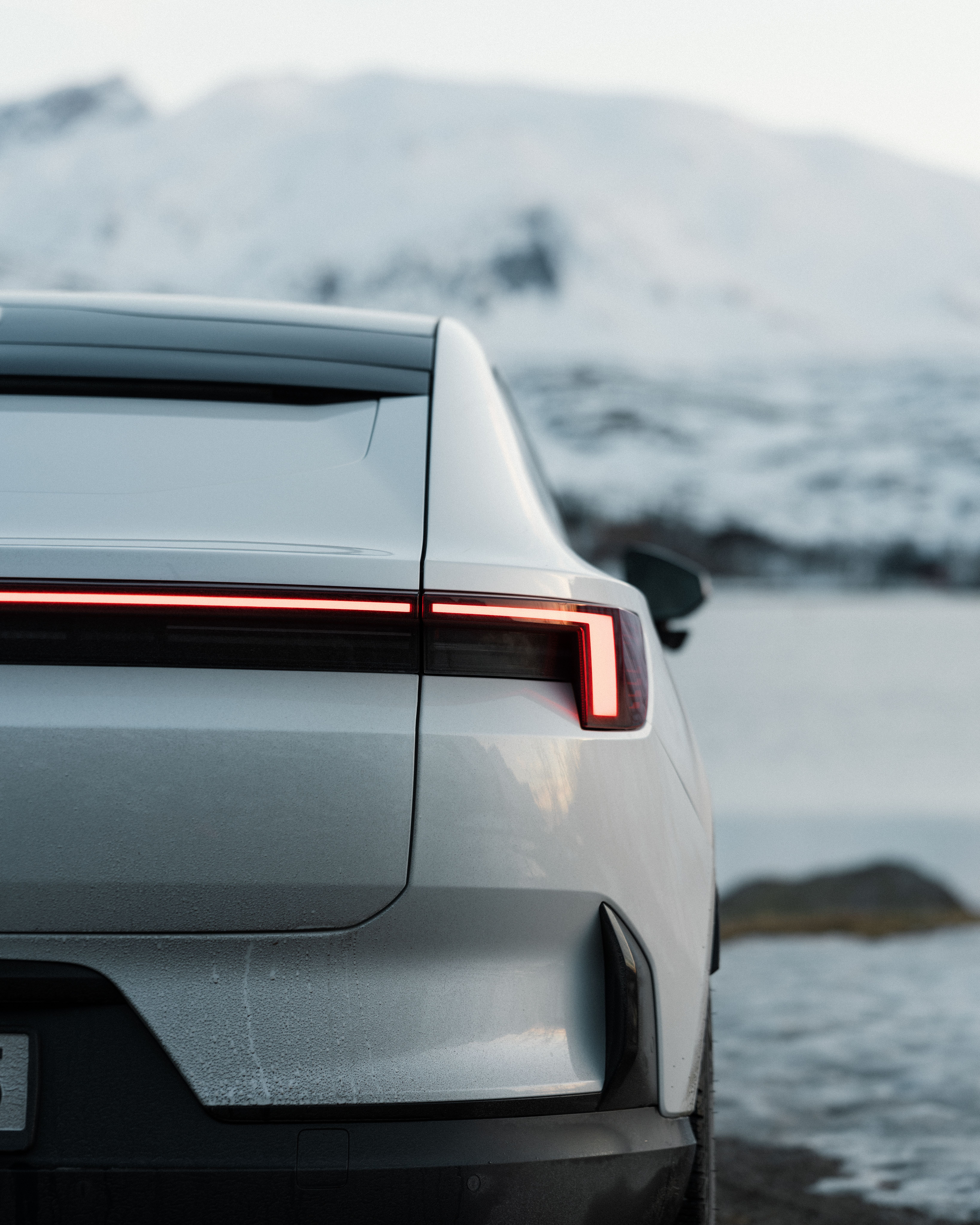 Back of Polestar 4 in front of mountains
