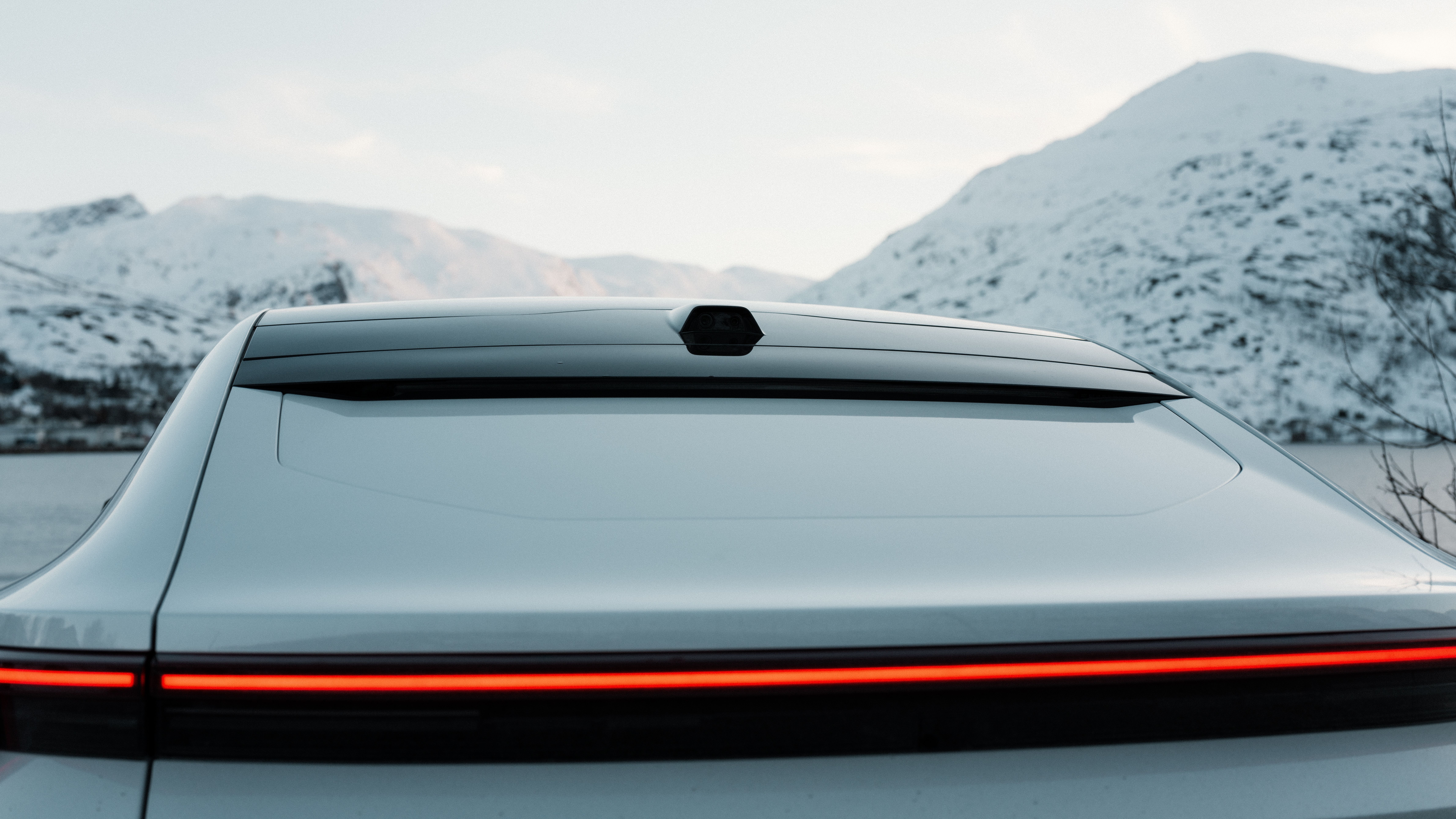 Back of Polestar 4 in front of mountains