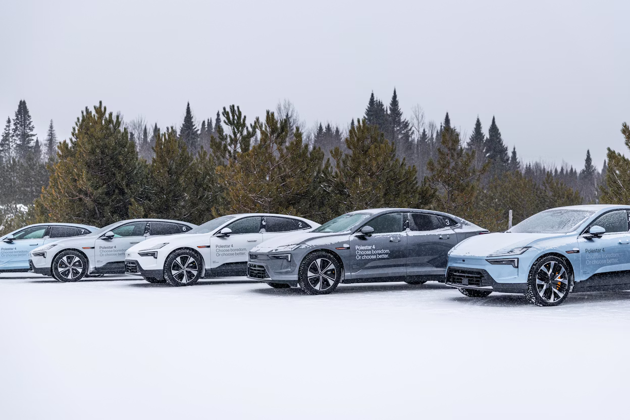 Polestar 4 cars against snowy and foresty background.