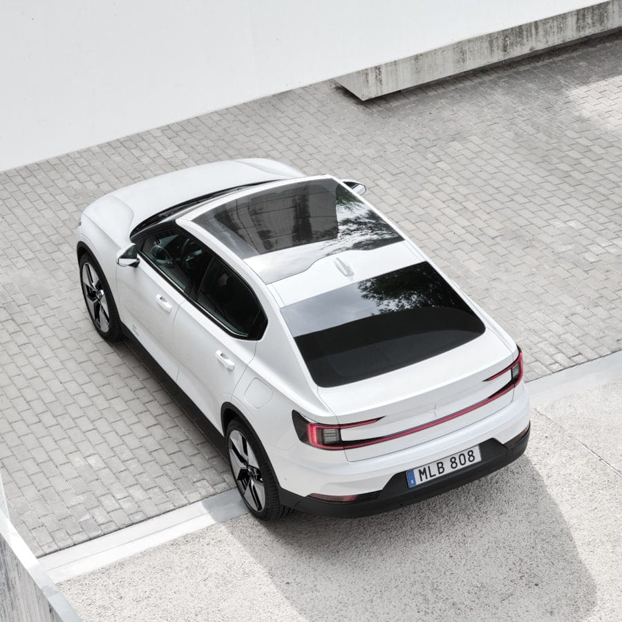White Polestar 2 driving out from a building