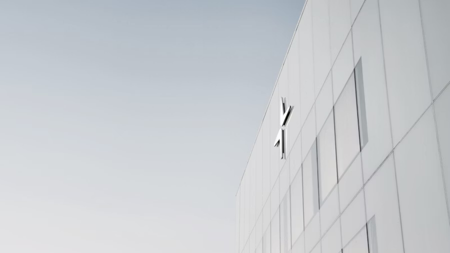 The white facade of Polestar HQ with the logo on top