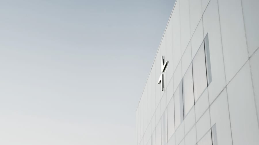 The white facade of Polestar HQ with the logo on top
