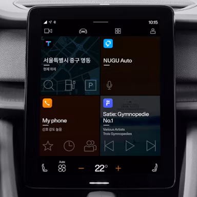 Polestar car infotainment screen showing navigation, music, phone, and climate control options.