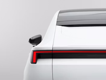 Rear view of a Polestar car showing taillight design and side mirror.