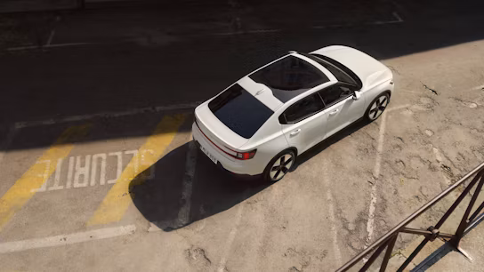 Bird view from the Polestar 2 in color Snow on the street