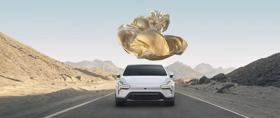 Polestar car on road in desert landscape with floating golden object above.