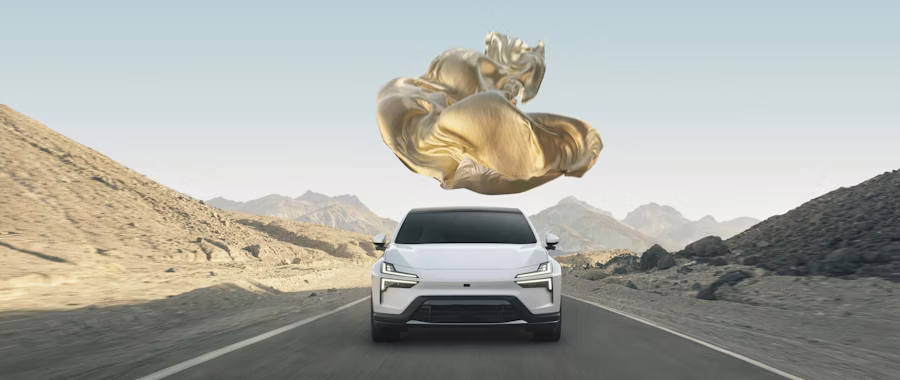 Polestar car on road in desert landscape with floating golden object above.