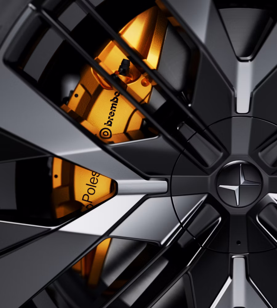 Close-up of a Polestar 3's performance wheel with Brembo brake caliper in Swedish gold.