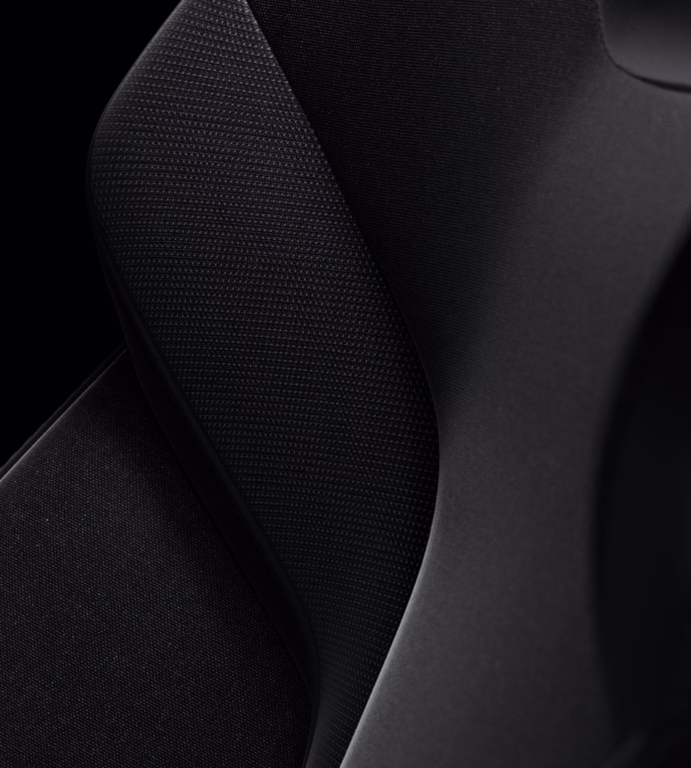 Close-up of Polestar 3’s Charcoal animal welfare-certified wool with textured patterns.