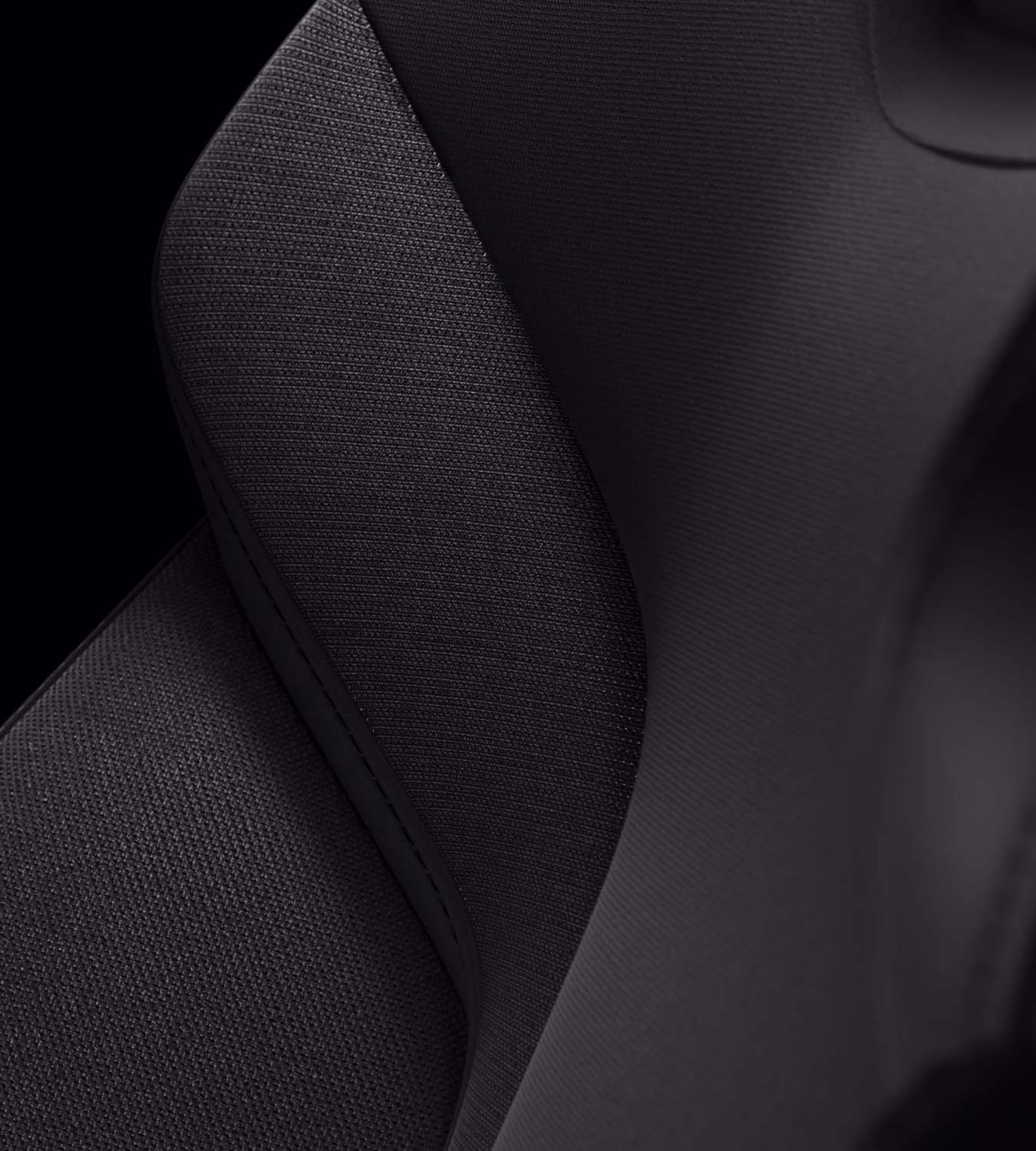 Close-up of Polestar 3’s seat with Charcoal bio-attributed WeaveTech with textured patterns.