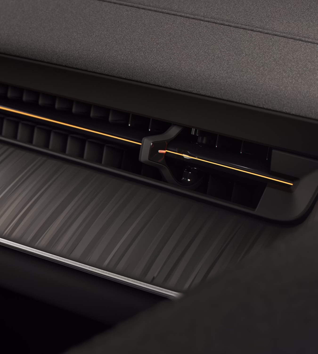 Close-up of Polestar 3’s Tectonic deco with a golden line across the ventilation.
