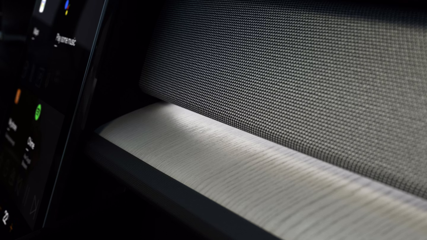 White interior lighting illuminating Polestar 2’s dashboard and centre console areas.