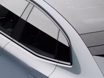 A top down view of back seat window of a grey Polestar 4