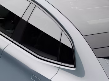 A top down view of back seat window of a grey Polestar 4