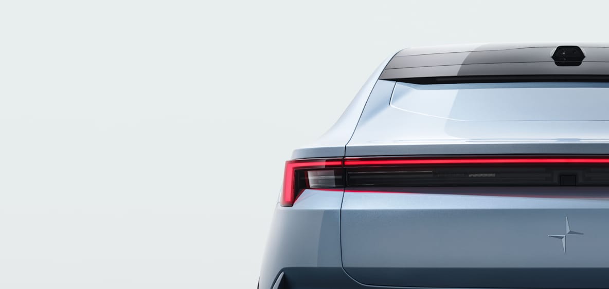 Blue Polestar 4 rear view close up in grey studio background