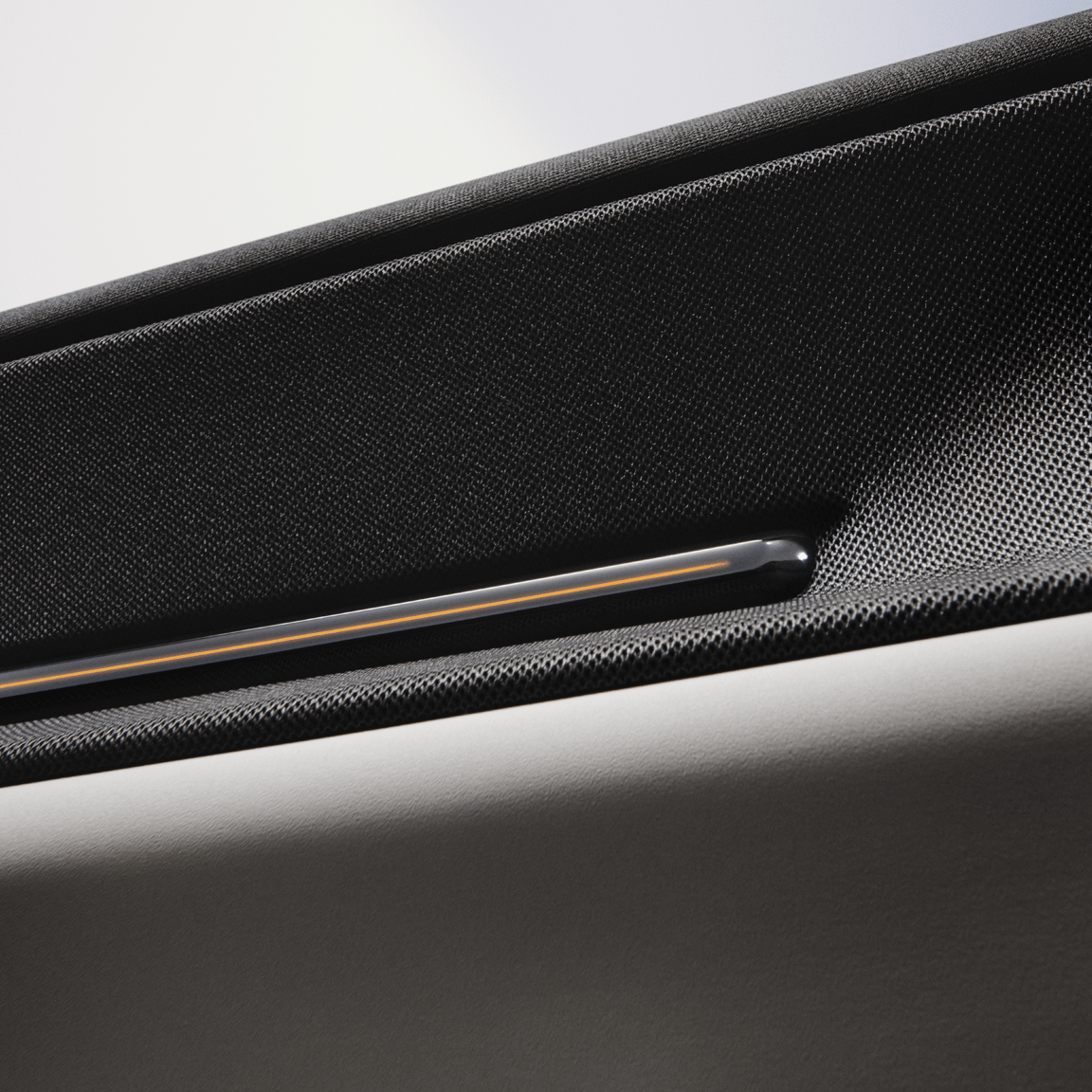 close up view of Polestar 3’s deco on the door panel with golden interior light line.