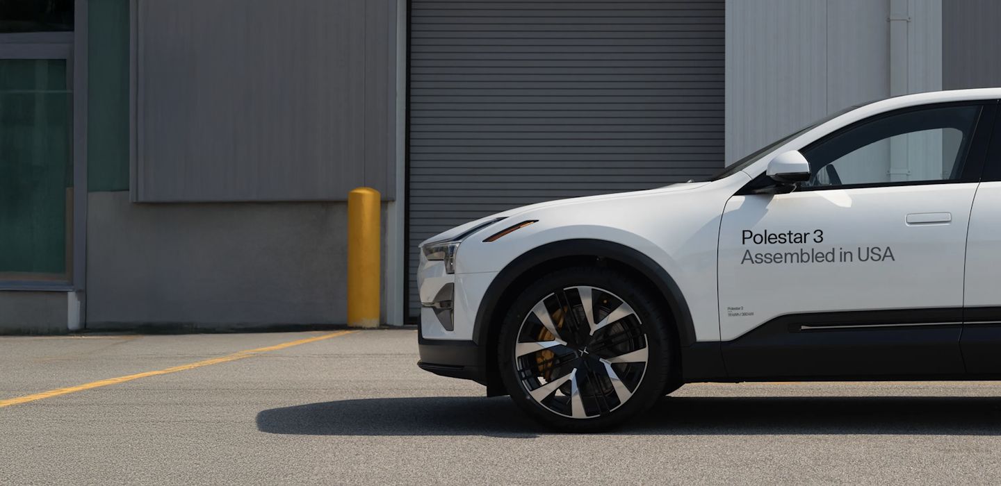 A white Polestar 3 with “assembled in USA” written on its left side.