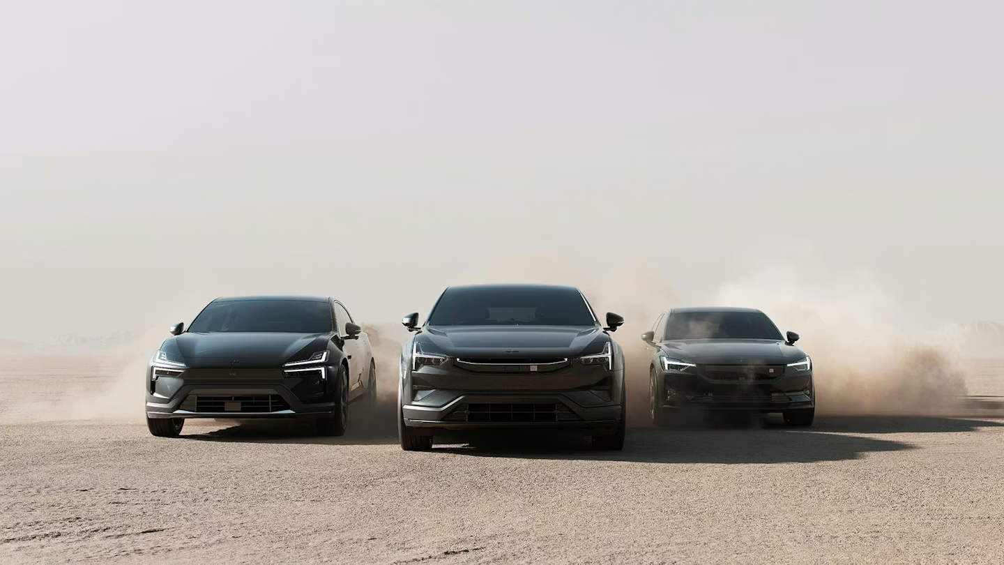 Polestar 2, Polestar 3, and Polestar 4 in grey colour driving side by side in a desert environment.
