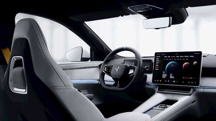Polestar 4 grey interior driver seat with infotainment screen and steering wheel.