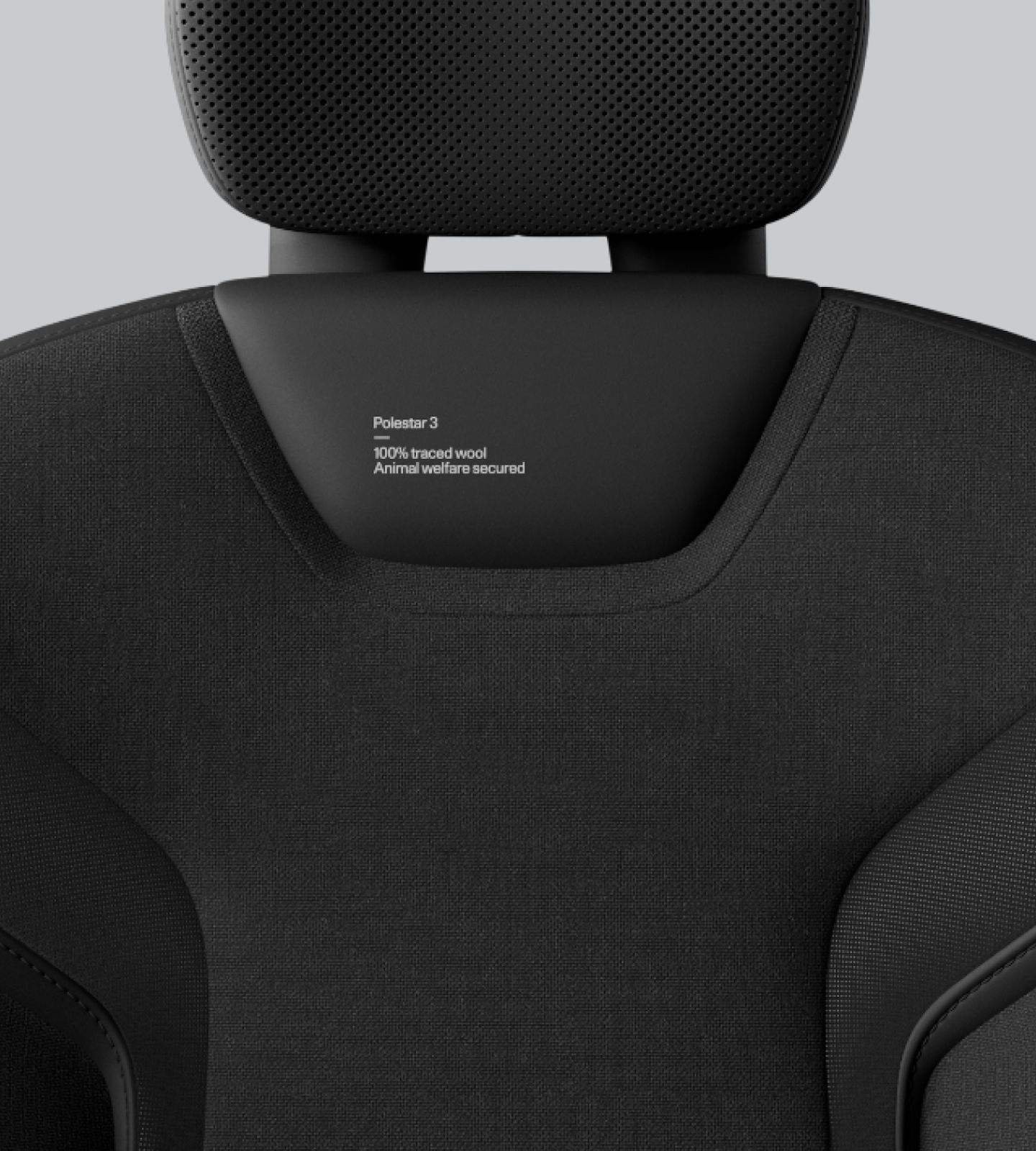Close-up of Polestar 3’s Charcoal animal welfare-certified wool with textured patterns.