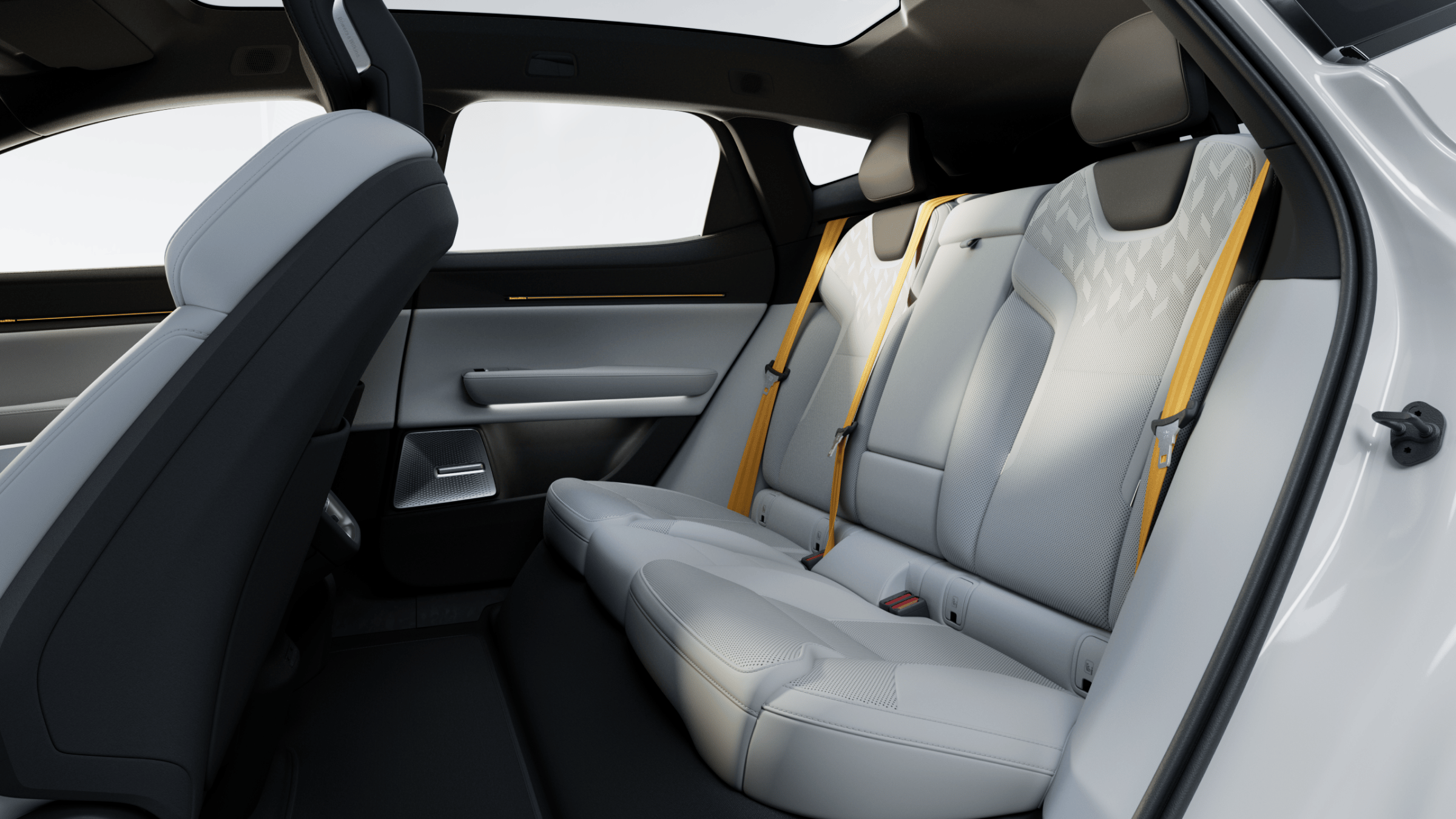 Interior view of Polestar 3’s rear seats with Swedish gold seat belts and passenger door.