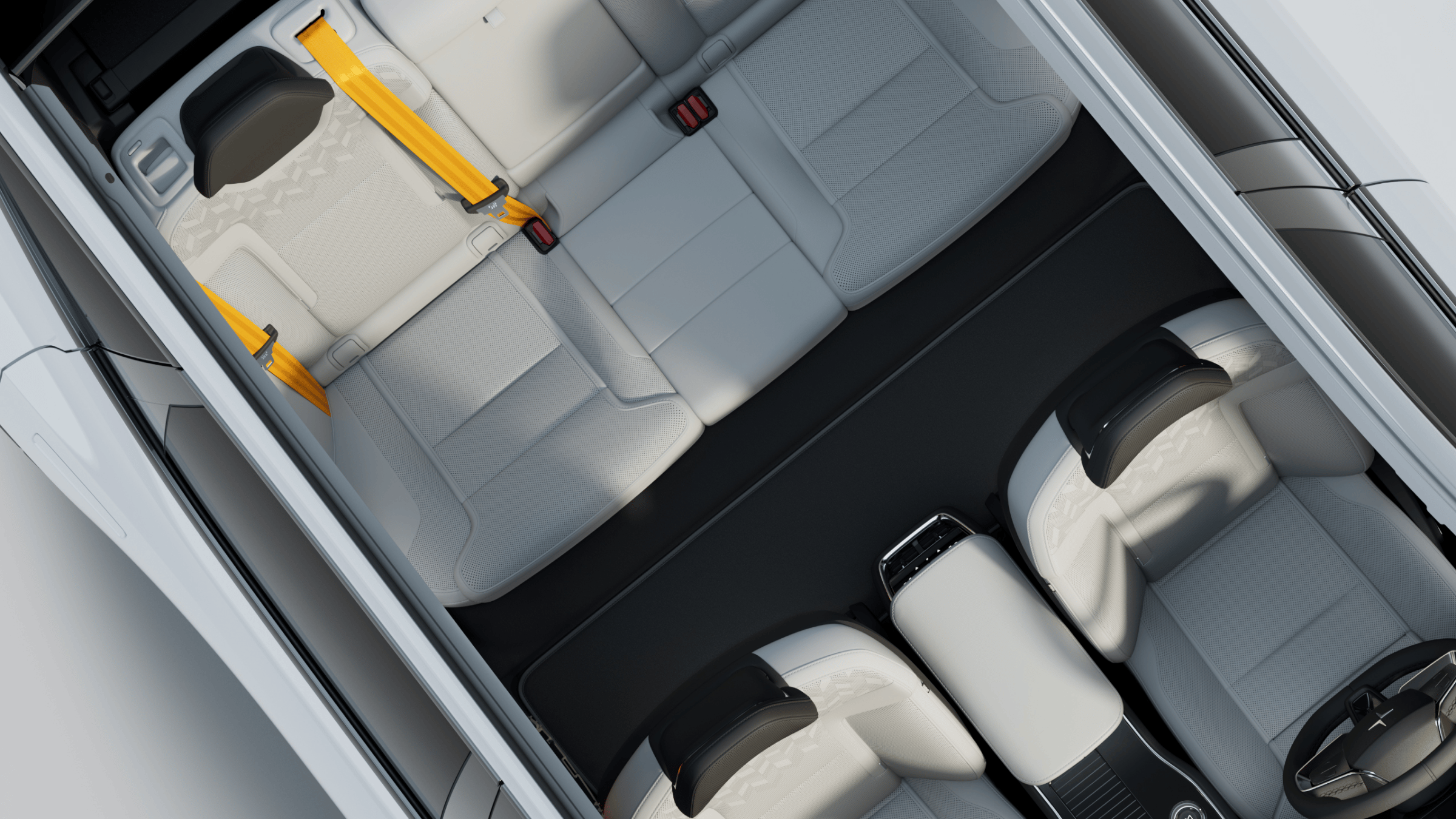 Angled bird’s eye view of Polestar 3’s interior showing all seats with Swedish gold seat belts.