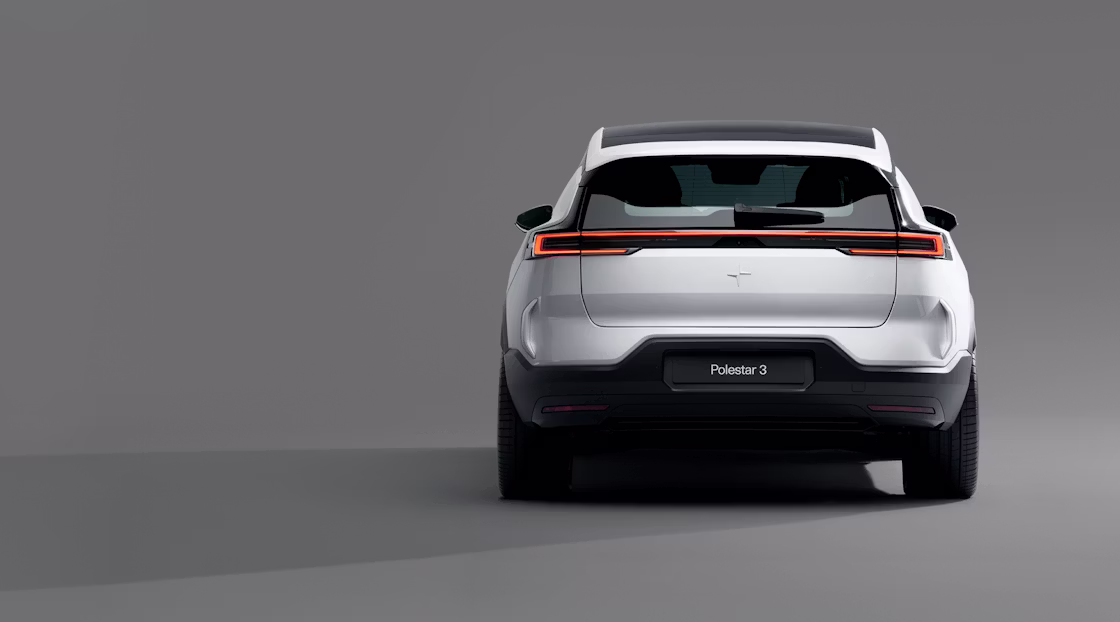 The back of Polestar 3 in Magnesium colour standing in a grey background.
