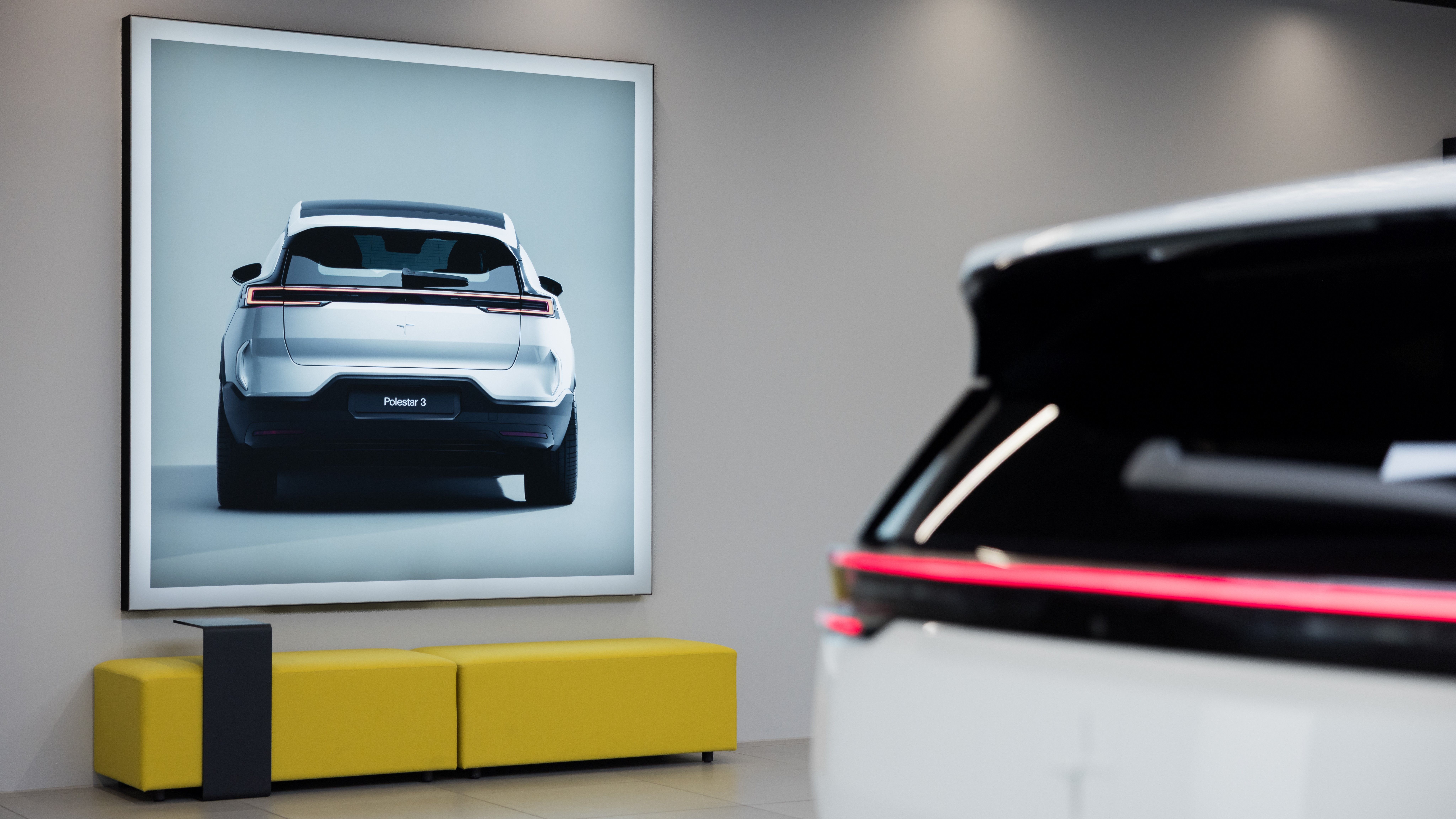 Polestar 3 in a space on a screen and a yellow bench