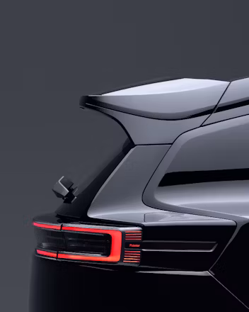 Rear view of Polestar 3 showing taillight and spoiler against a dark background.