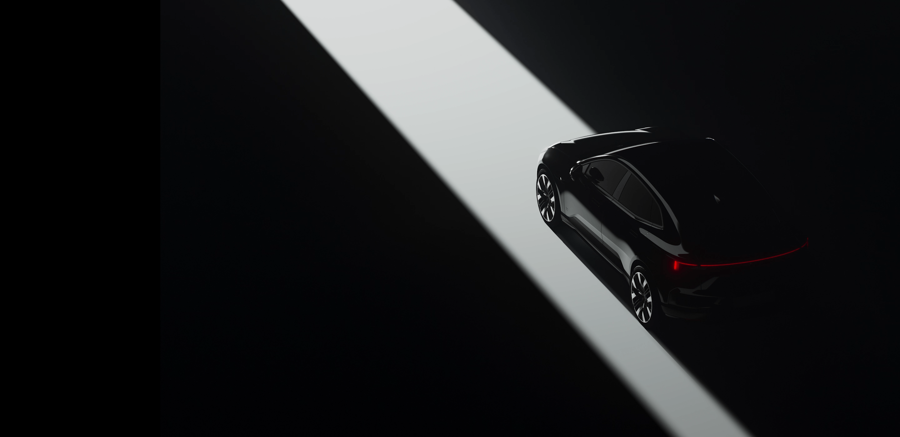 Polestar 4 car in dark setting with rear lights illuminated, positioned in a beam of light on a black background.