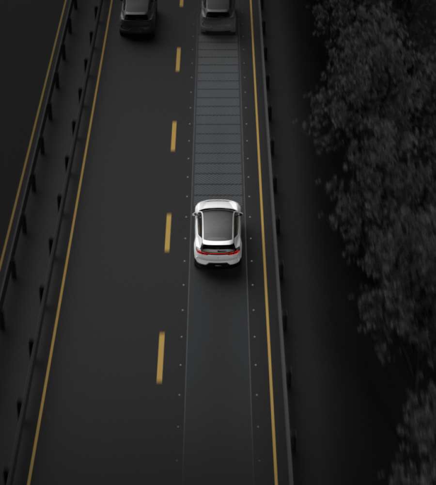 Polestar 3 driving on a road and monitoring the distance between itself and the car ahead.