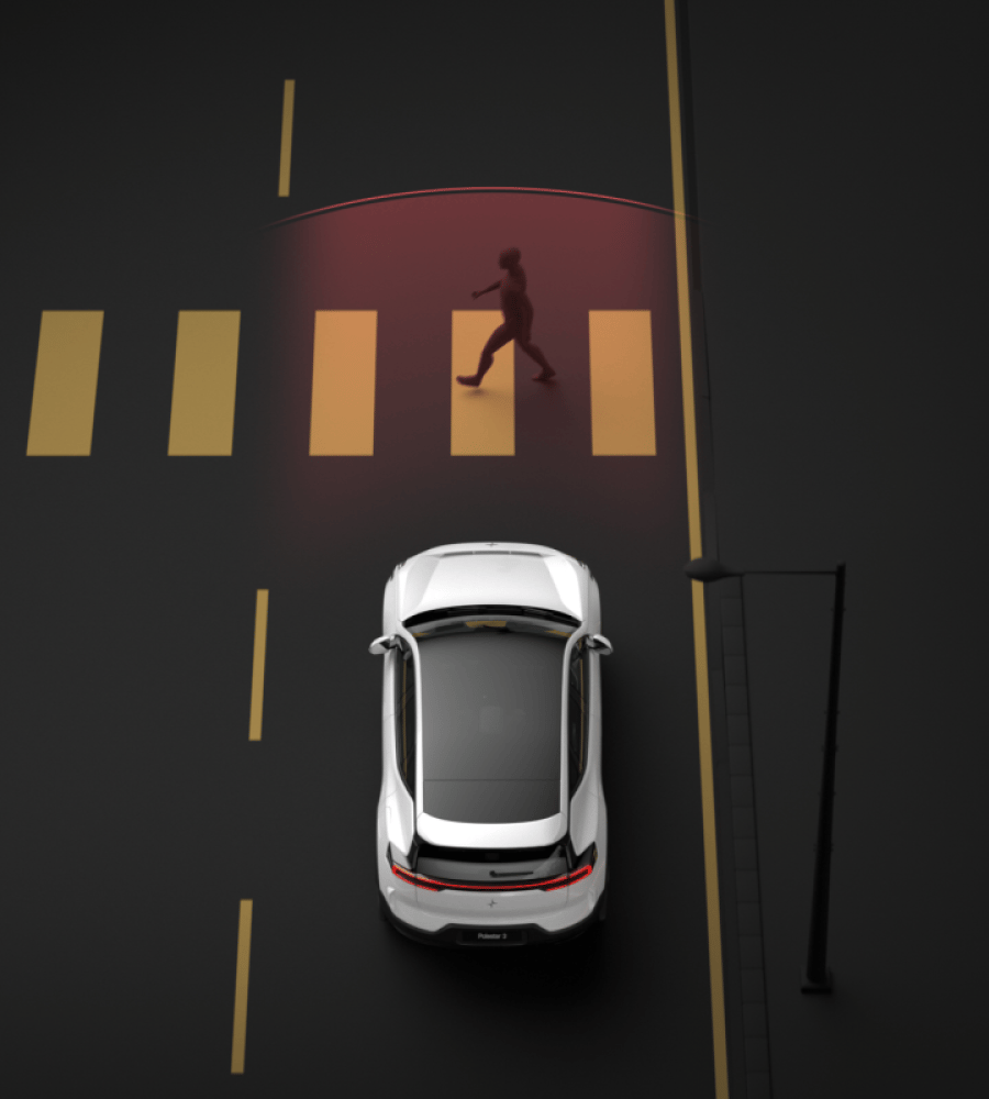 Polestar 3 driving and braking automatically when detecting a pedestrian on a marked crosswalk.