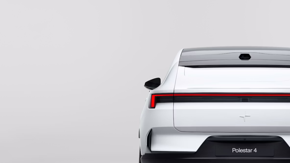 Rear view of Polestar 4 with red tail light, white body, and Polestar logo on a light gray background.